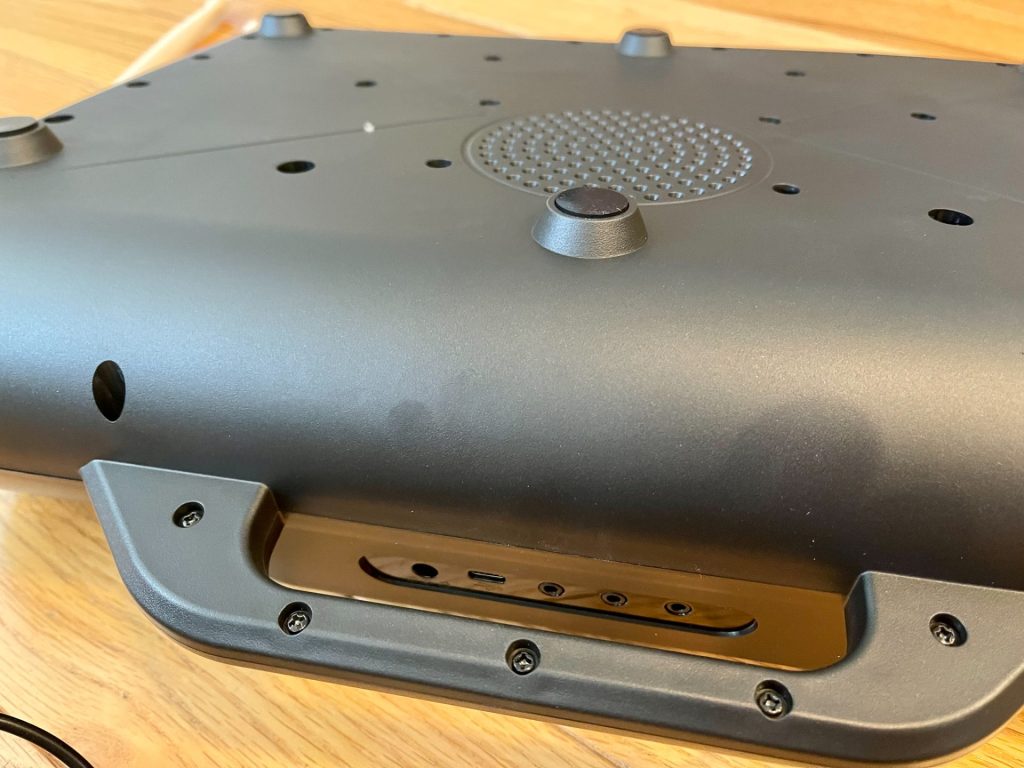 The underside and rear ports. That single speaker is quite loud and clear.