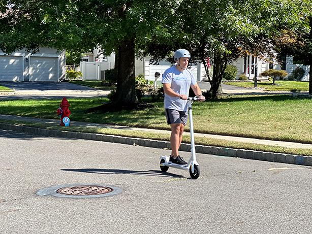 Man riding MegaWheels Electric Scooter