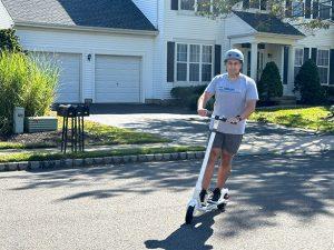 Man riding MegaWheel Electric Scooter