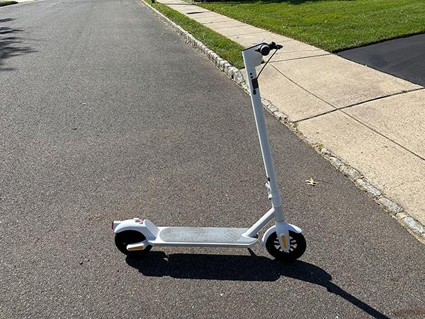 MegaWheels Electric Scooter outside