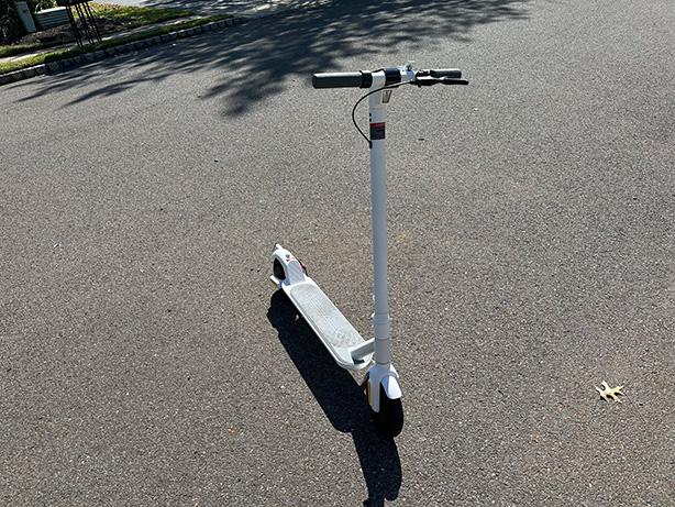 MegaWheels Electric Scooter outside