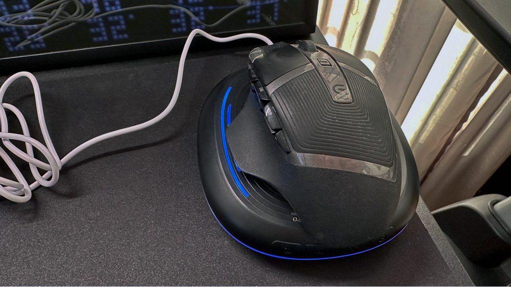 Logitech mouse on top of VKAROOD Computer Mouse Jiggler