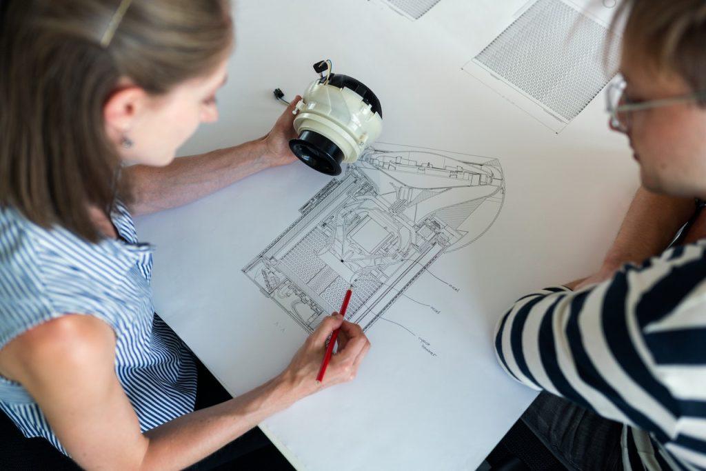 Women working on an engineering drawing
